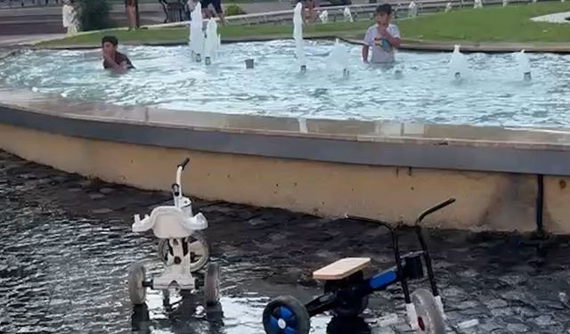 Bolu'da tehlikeli serinlik: Yasağa ve elektrik akımına aldırış etmeden süs havuzunda yüzdüler