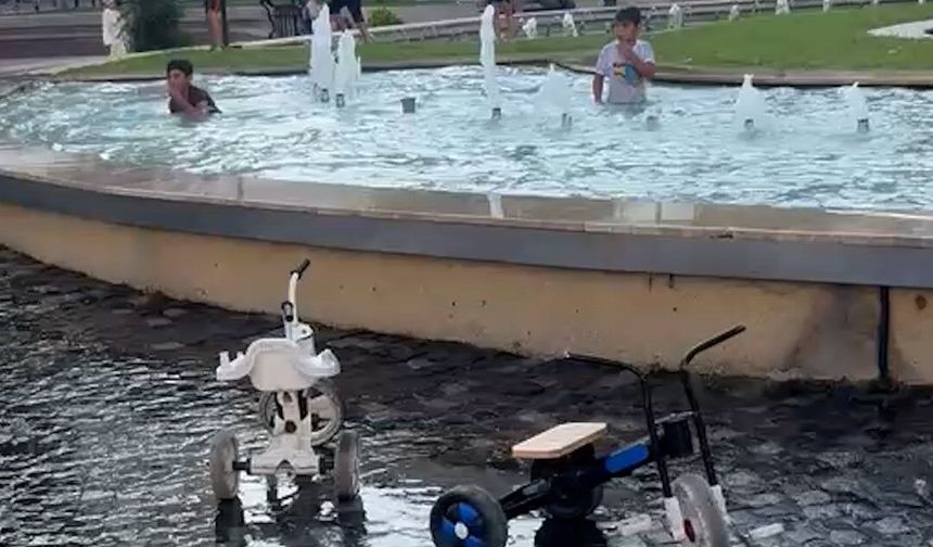 Bolu'da tehlikeli serinlik: Yasağa ve elektrik akımına aldırış etmeden süs havuzunda yüzdüler